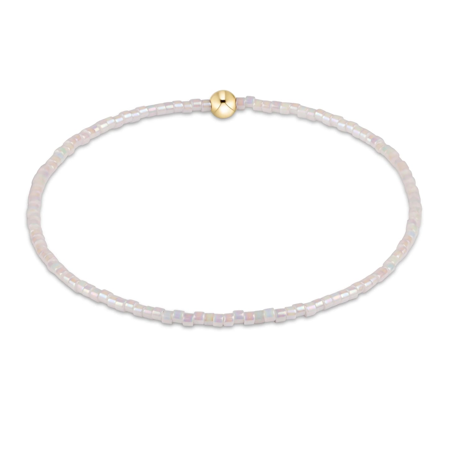 Delicate bracelet with small beads and a gold clasp on a white background