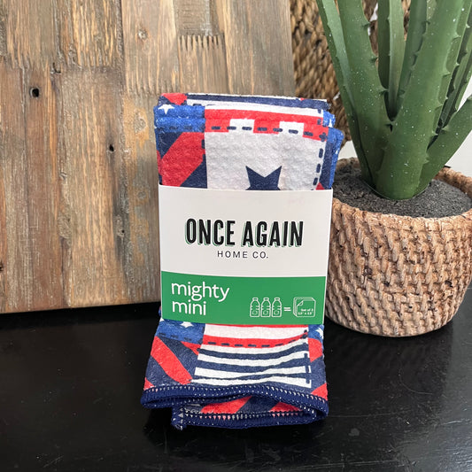 Packaged product with 'Once Again Home Co.' label on a wooden surface with a plant in the background