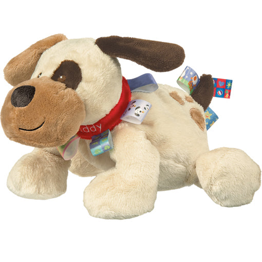 Plush dog toy with a red collar and colorful tags on a white background