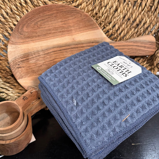 Blue cloth with a label on a woven surface with wooden items