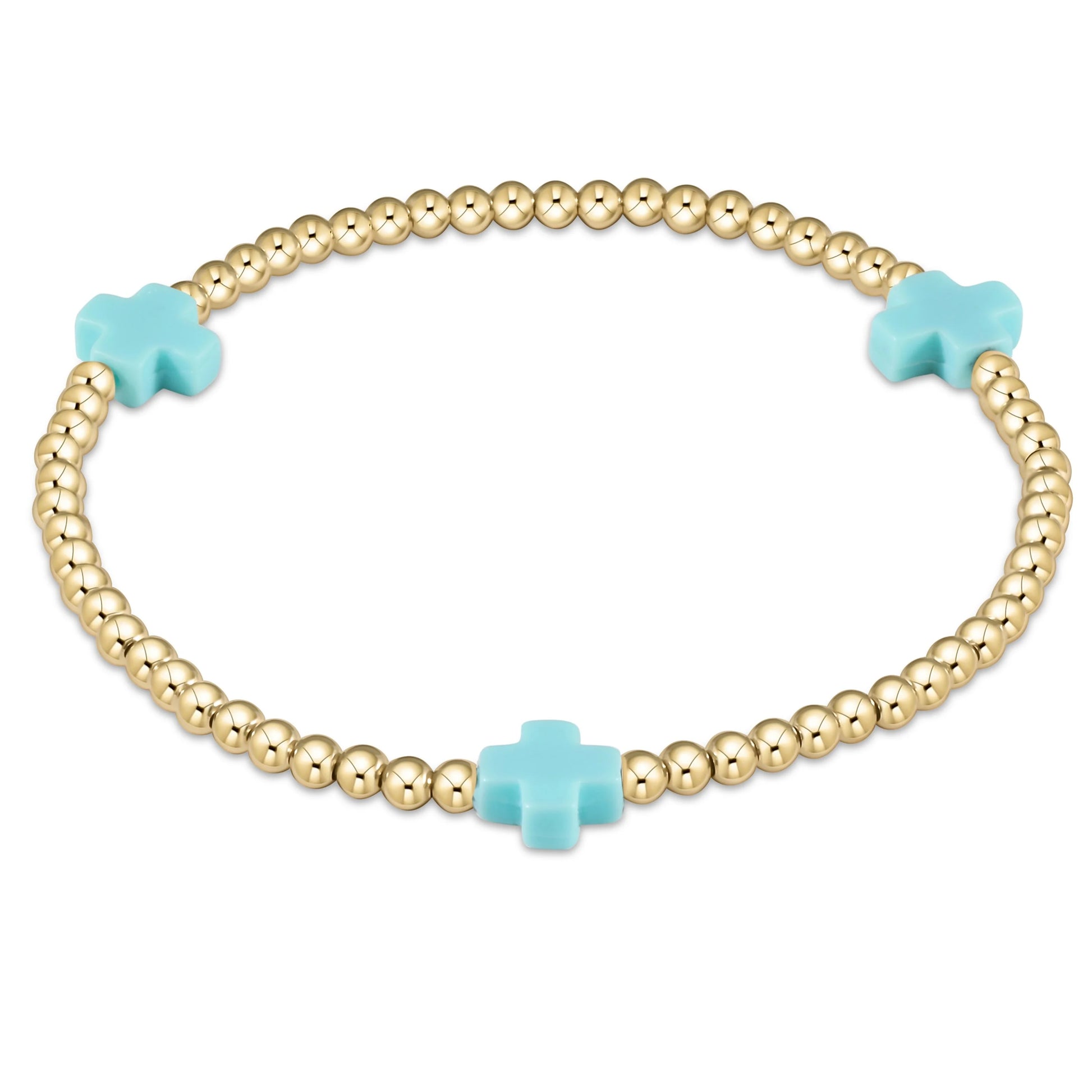 Gold beaded bracelet with turquoise cross-shaped beads on a white background