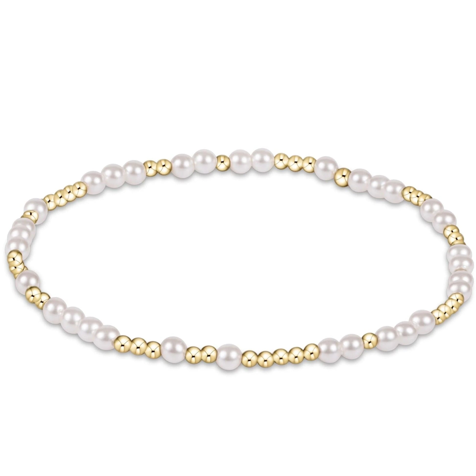 Pearl and gold beaded bracelet on a white background