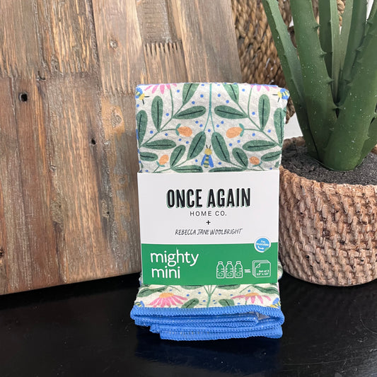 Packaged product with 'Once Again Home Co.' branding on a wooden surface with a plant in the background.