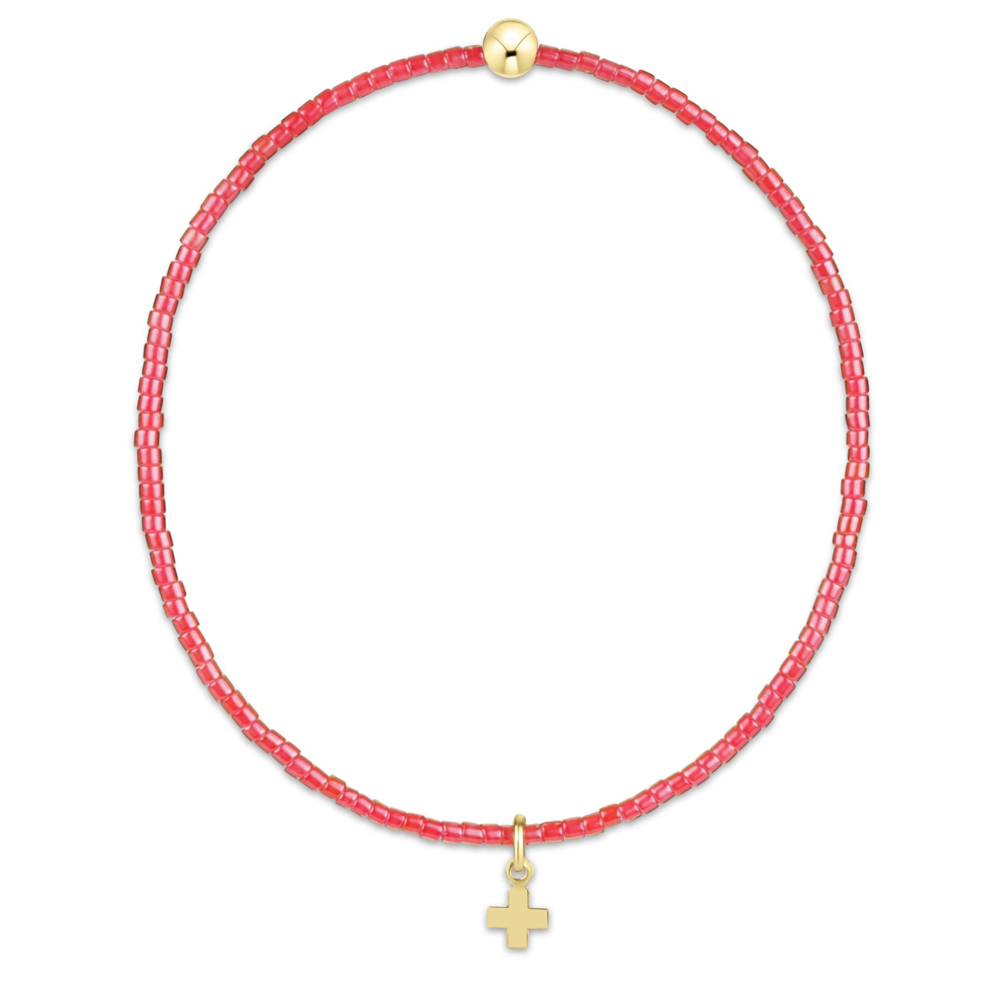 Pink beaded bracelet with a gold cross charm on a white background