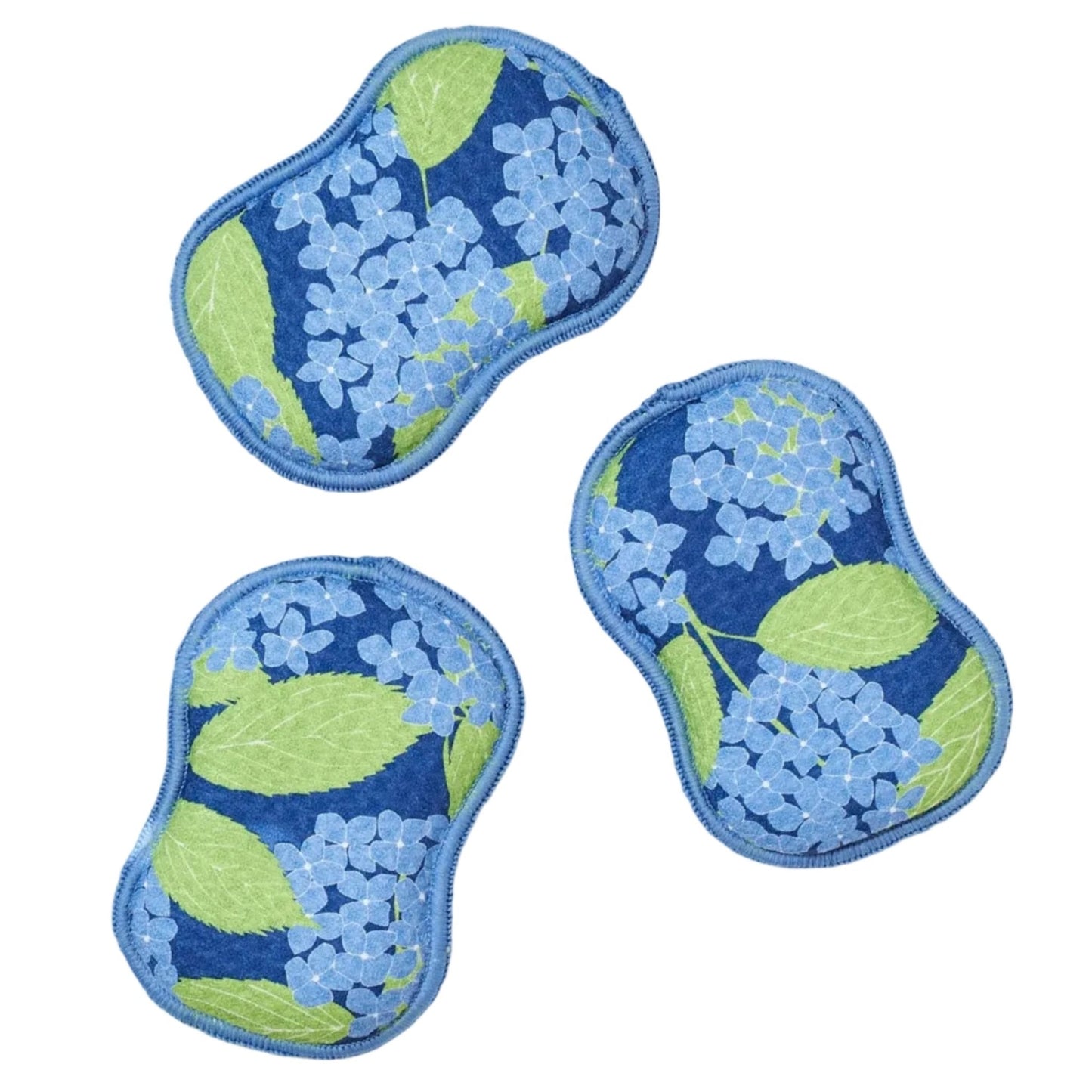 Three blue floral eye masks on a white background